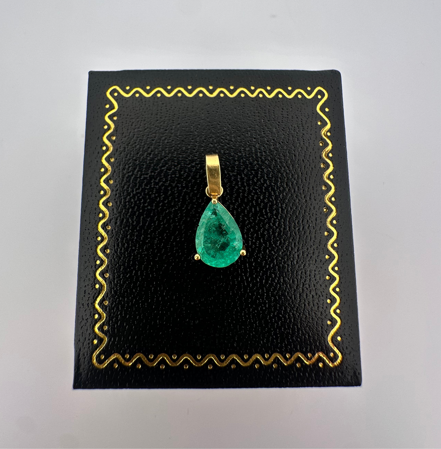 Vintage natural emerald pear shaped pendant set in 14k yellow gold