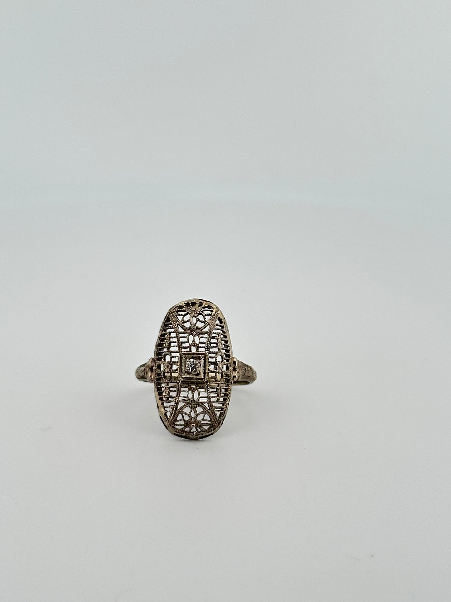 Antique art deco 18k white gold shield ring with natural diamonds