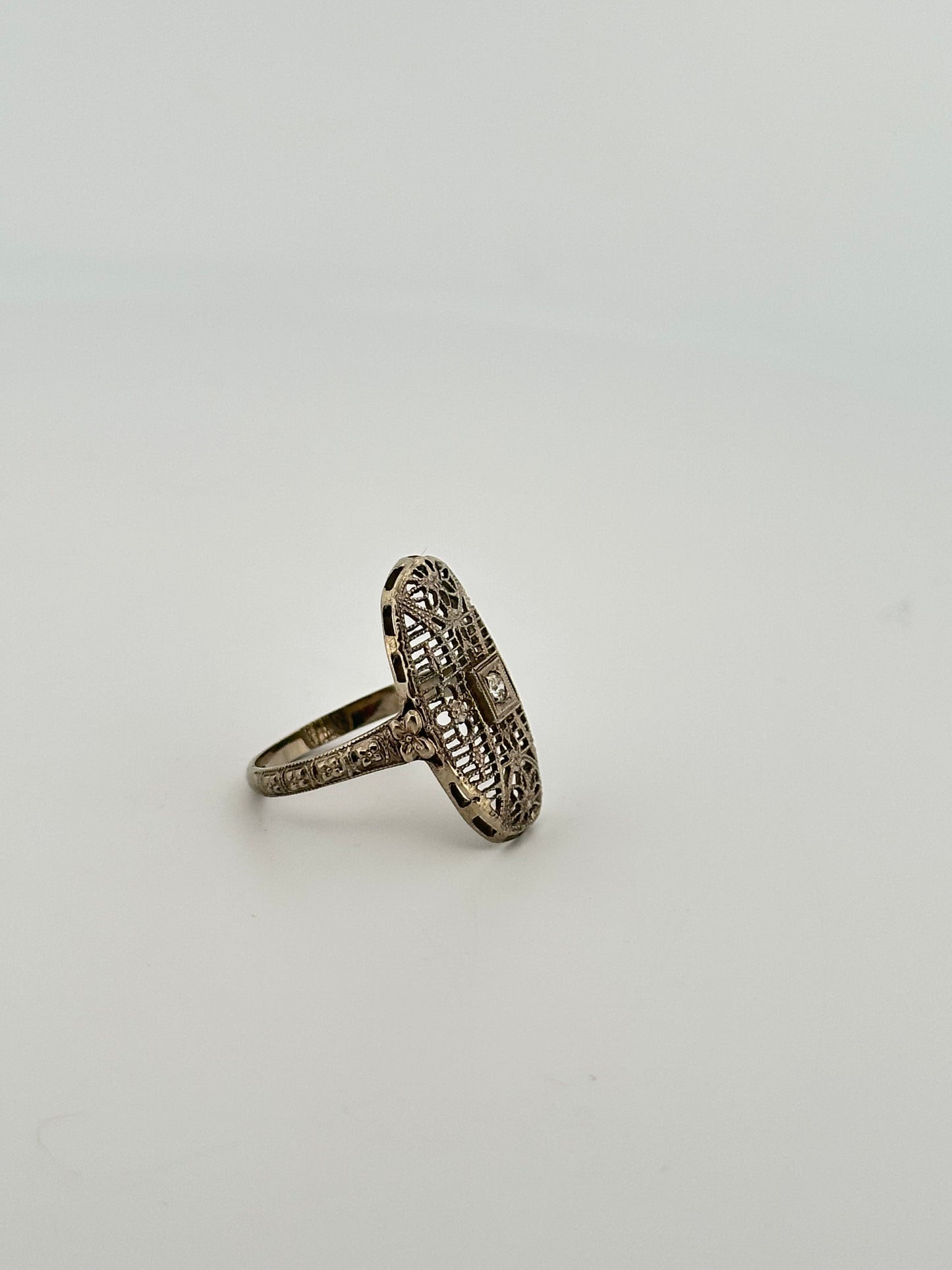 Antique art deco 18k white gold shield ring with natural diamonds