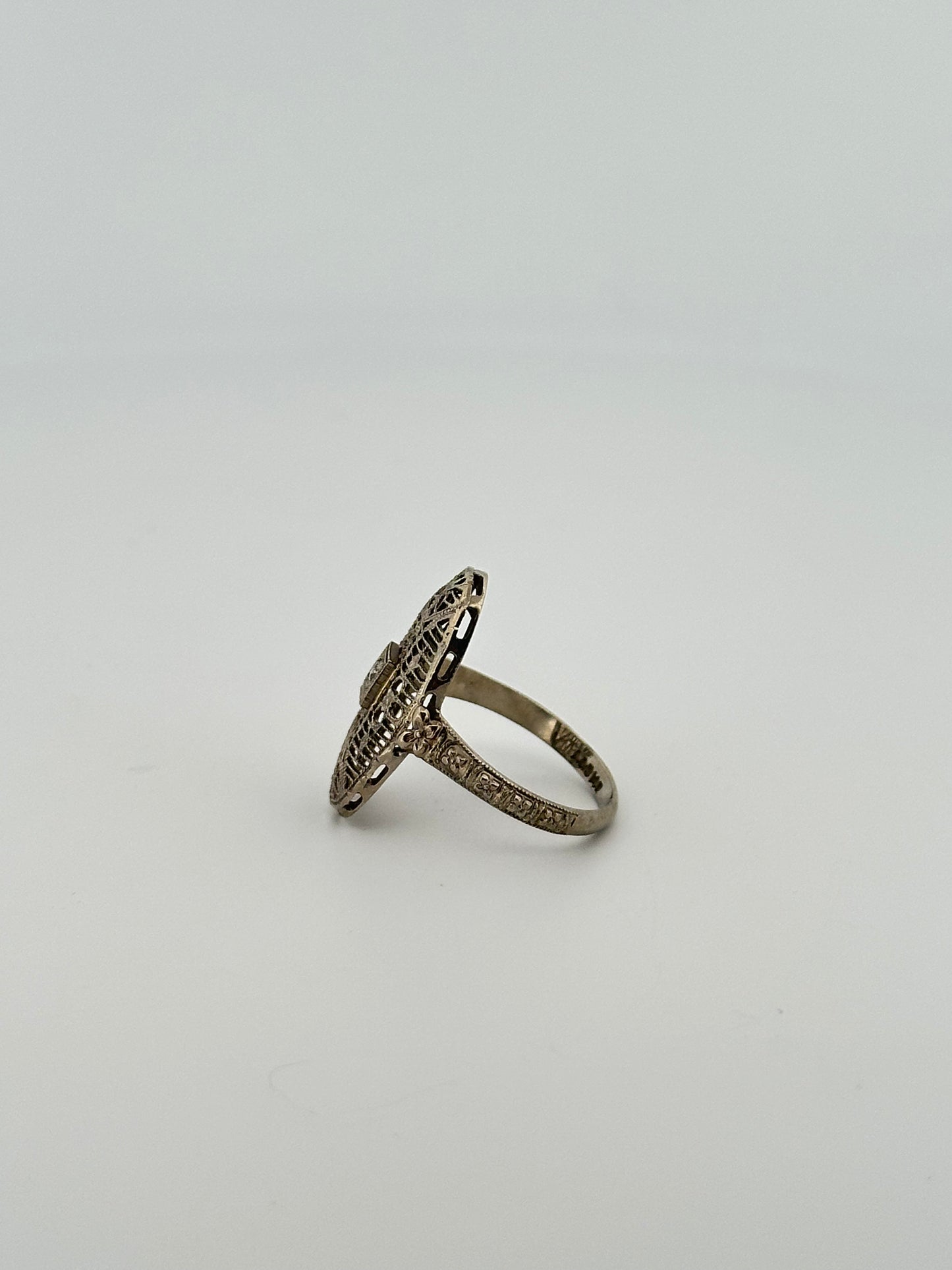 Antique art deco 18k white gold shield ring with natural diamonds