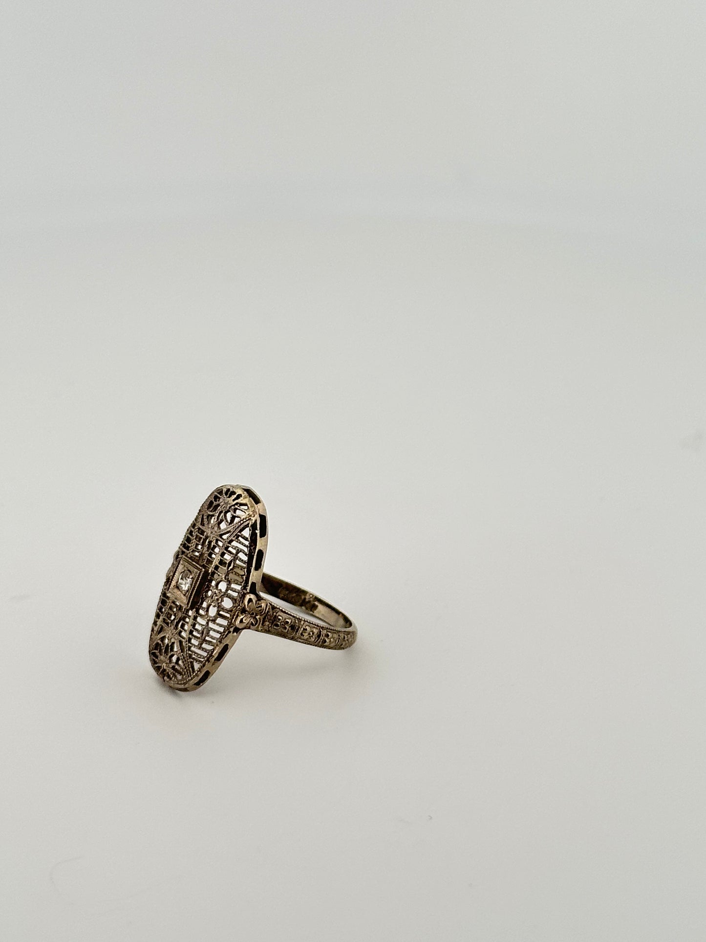 Antique art deco 18k white gold shield ring with natural diamonds