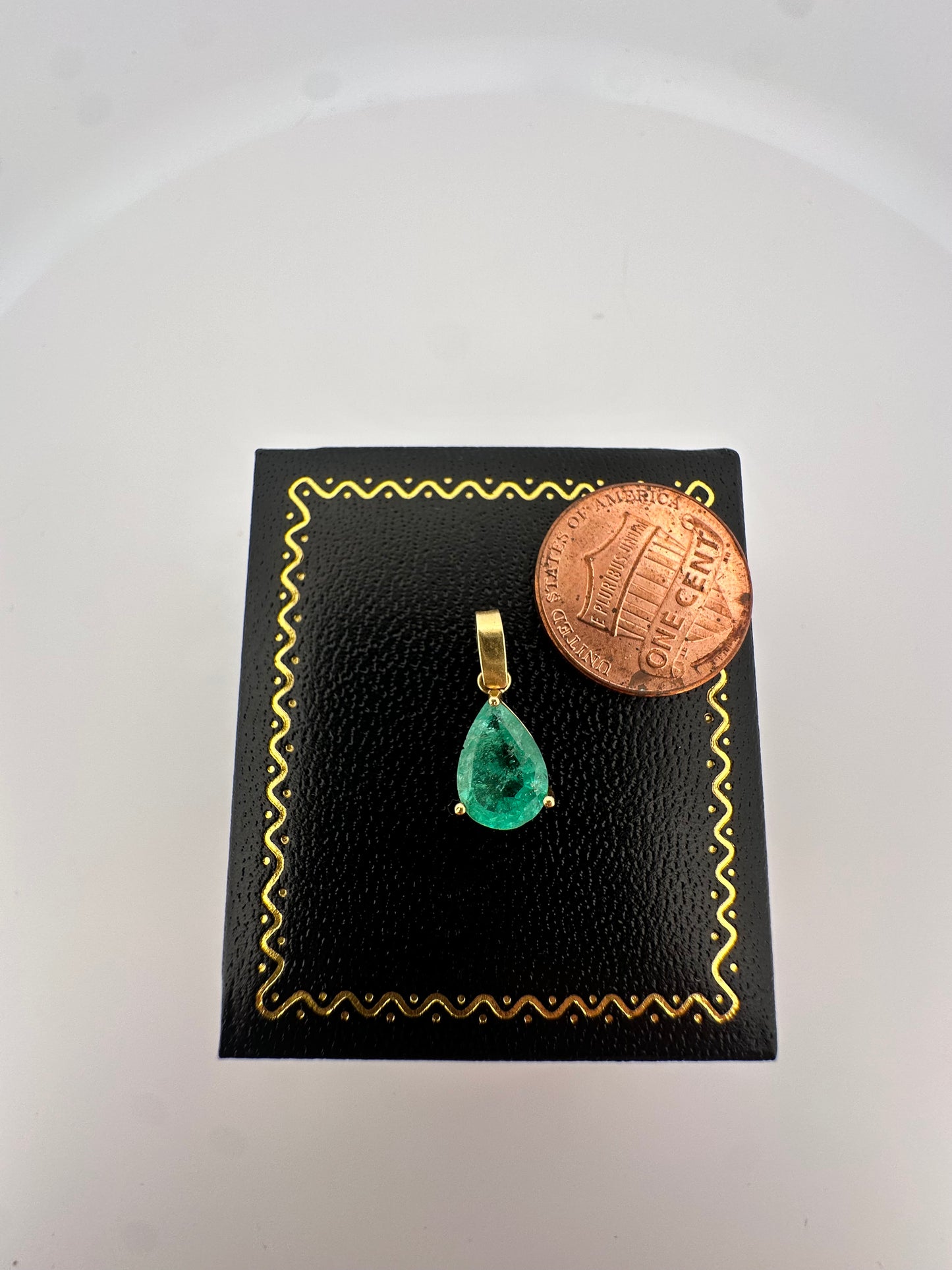 Vintage natural emerald pear shaped pendant set in 14k yellow gold