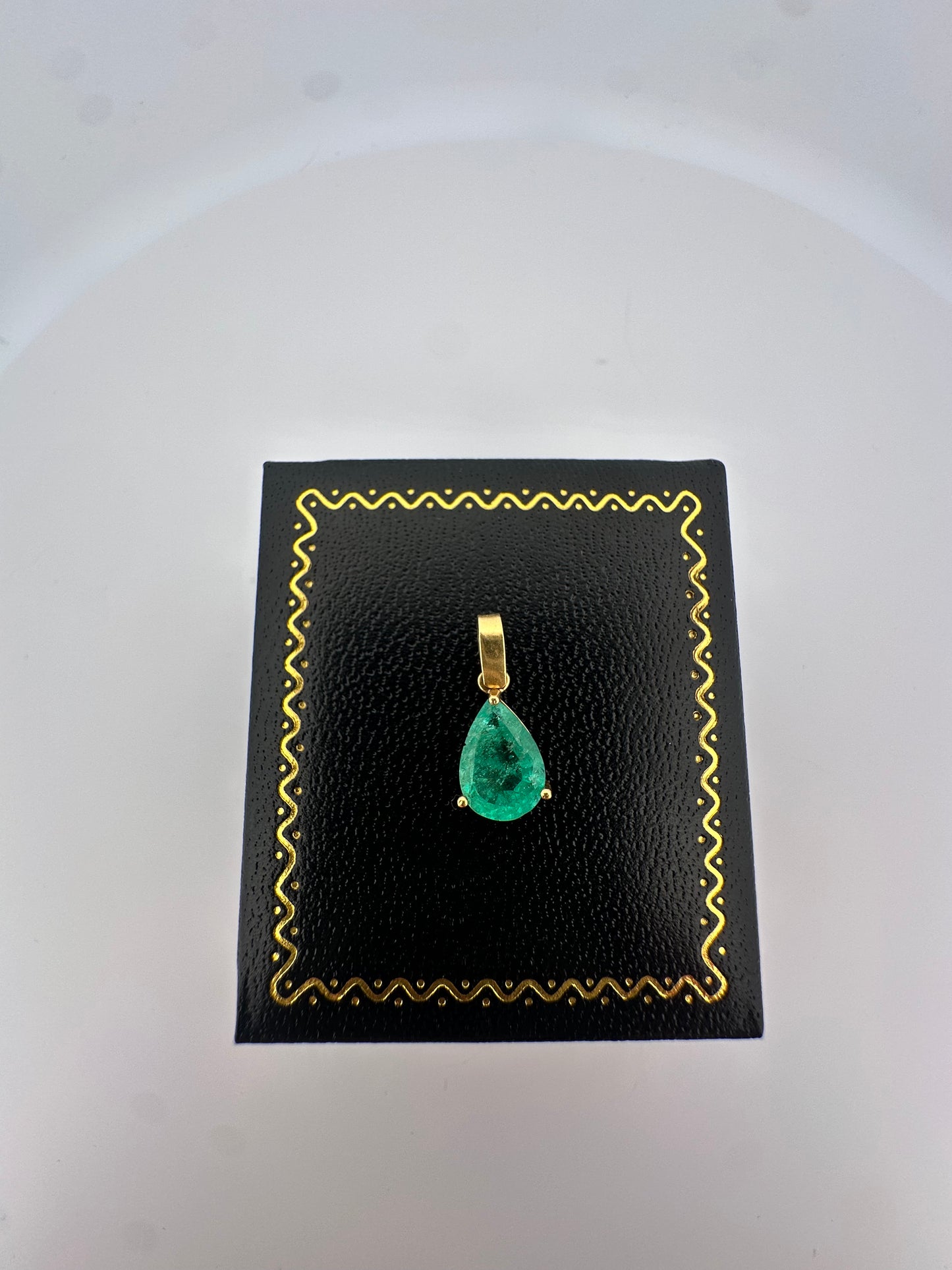 Vintage natural emerald pear shaped pendant set in 14k yellow gold