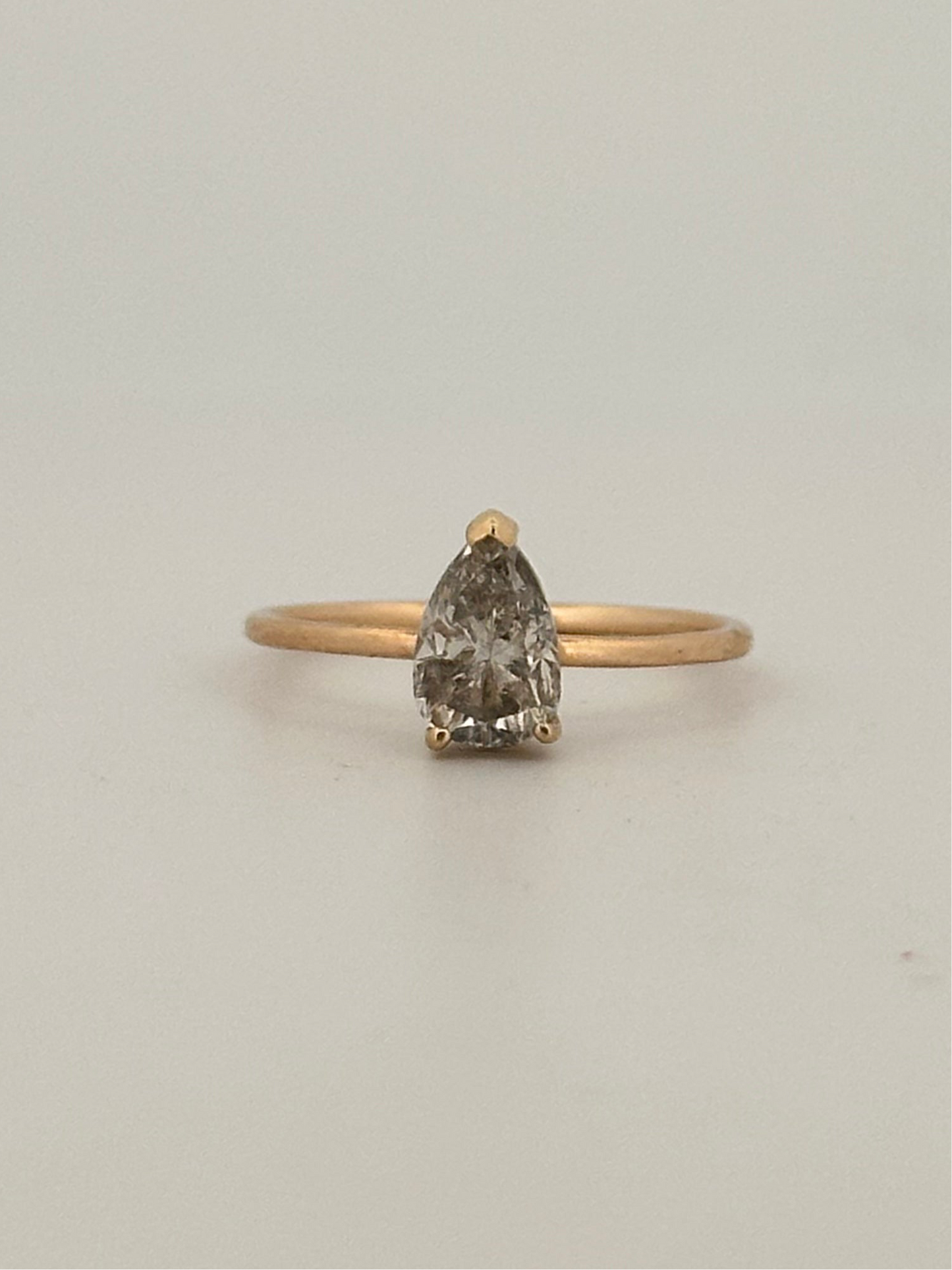 Vintage natural pear shaped diamond solitaire ring in 14k yellow gold