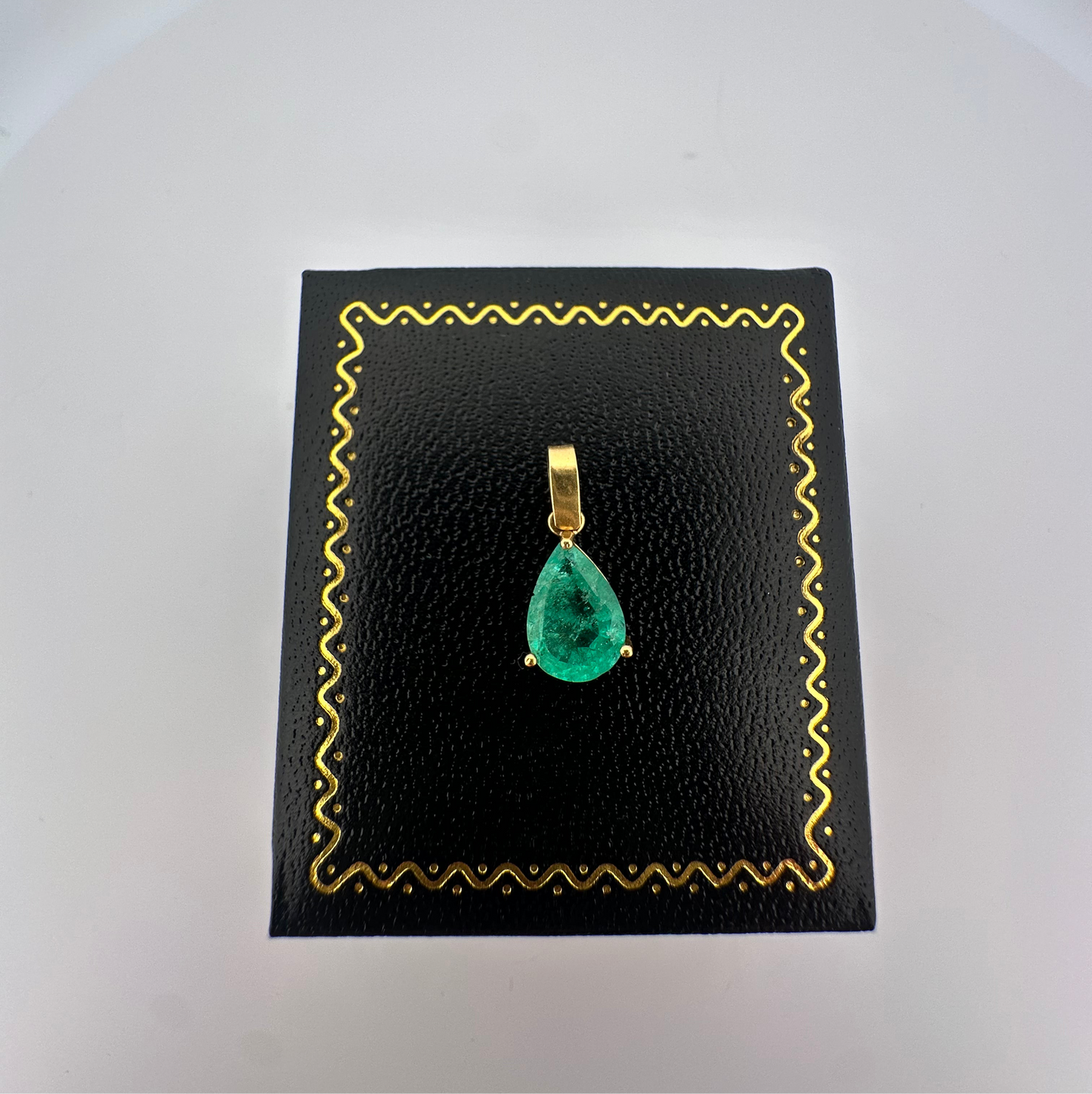 Vintage natural emerald pear shaped pendant set in 14k yellow gold