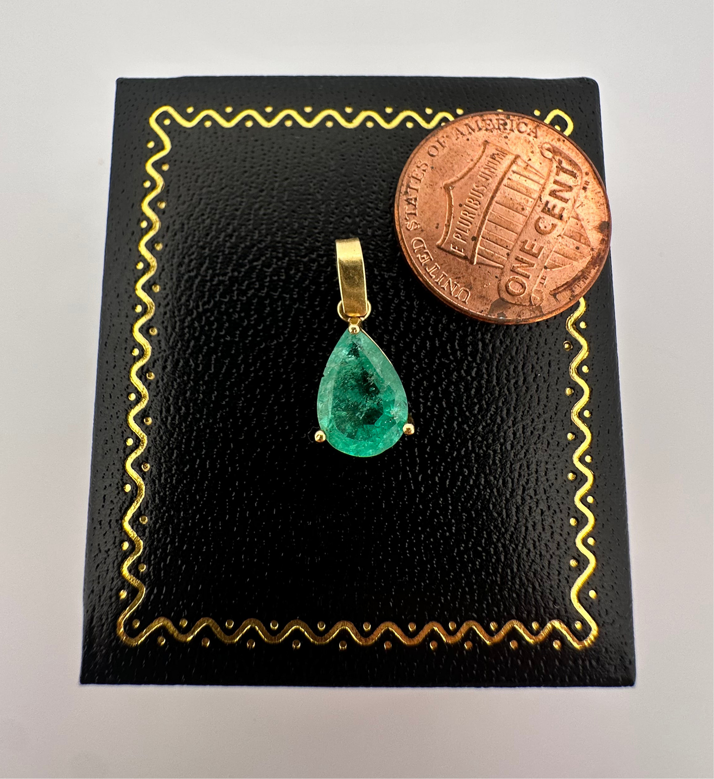 Vintage natural emerald pear shaped pendant set in 14k yellow gold