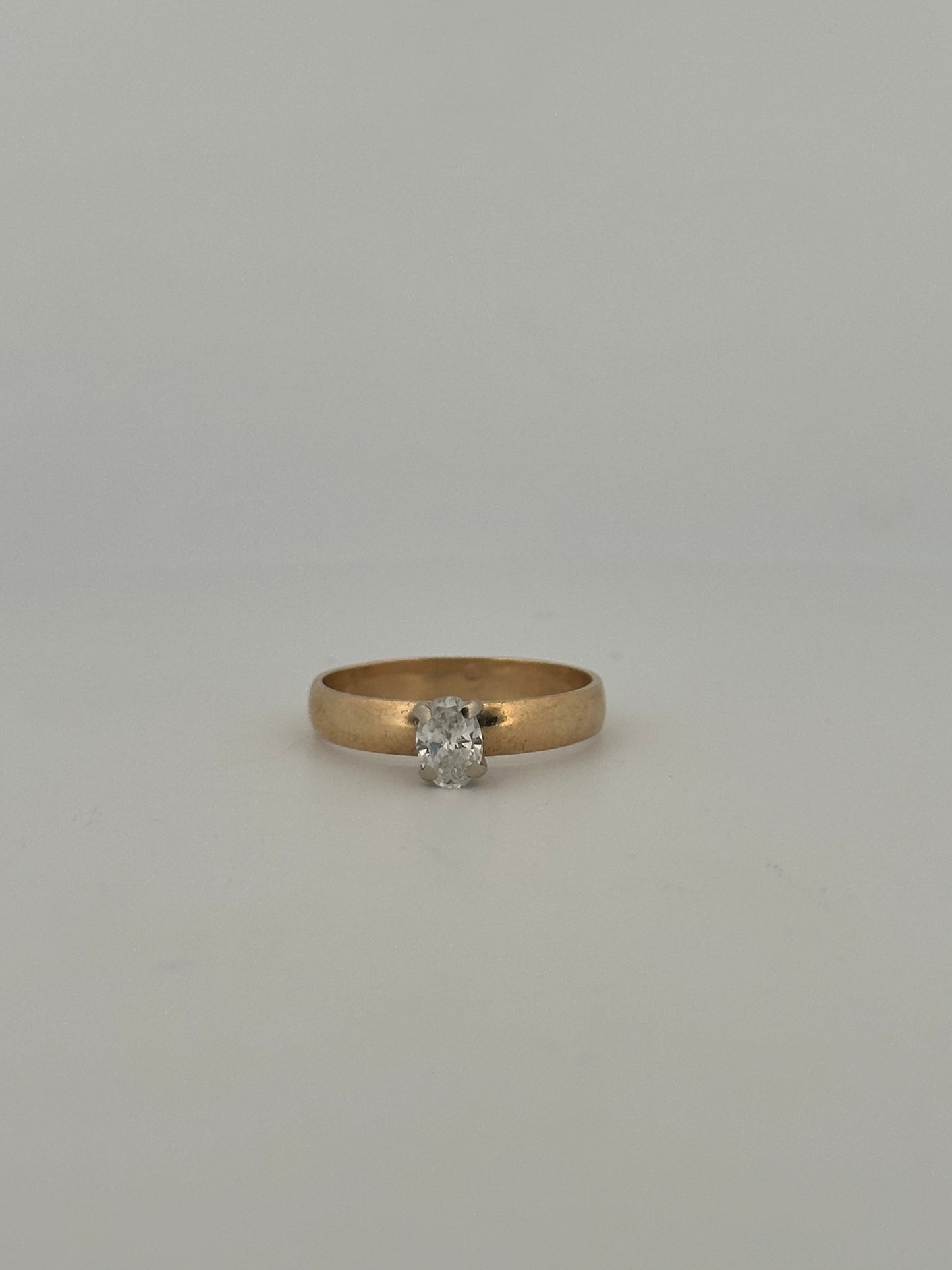 Vintage natural cut oval diamond solitaire ring on thick 14k yellow gold band