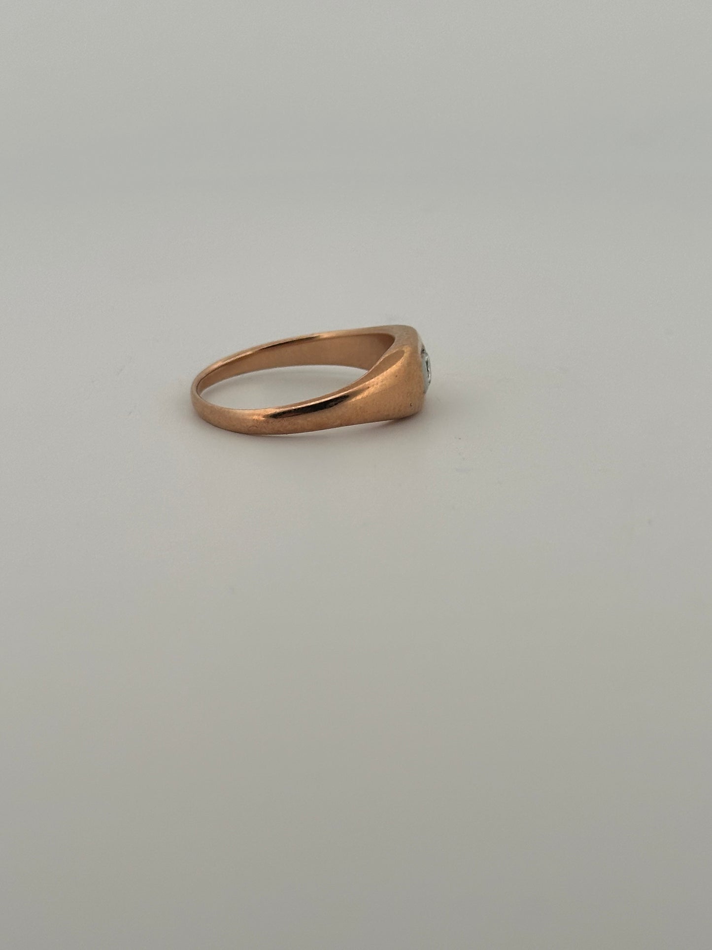 Antique two toned rose and white gold signet ring in 14k with a natural diamond