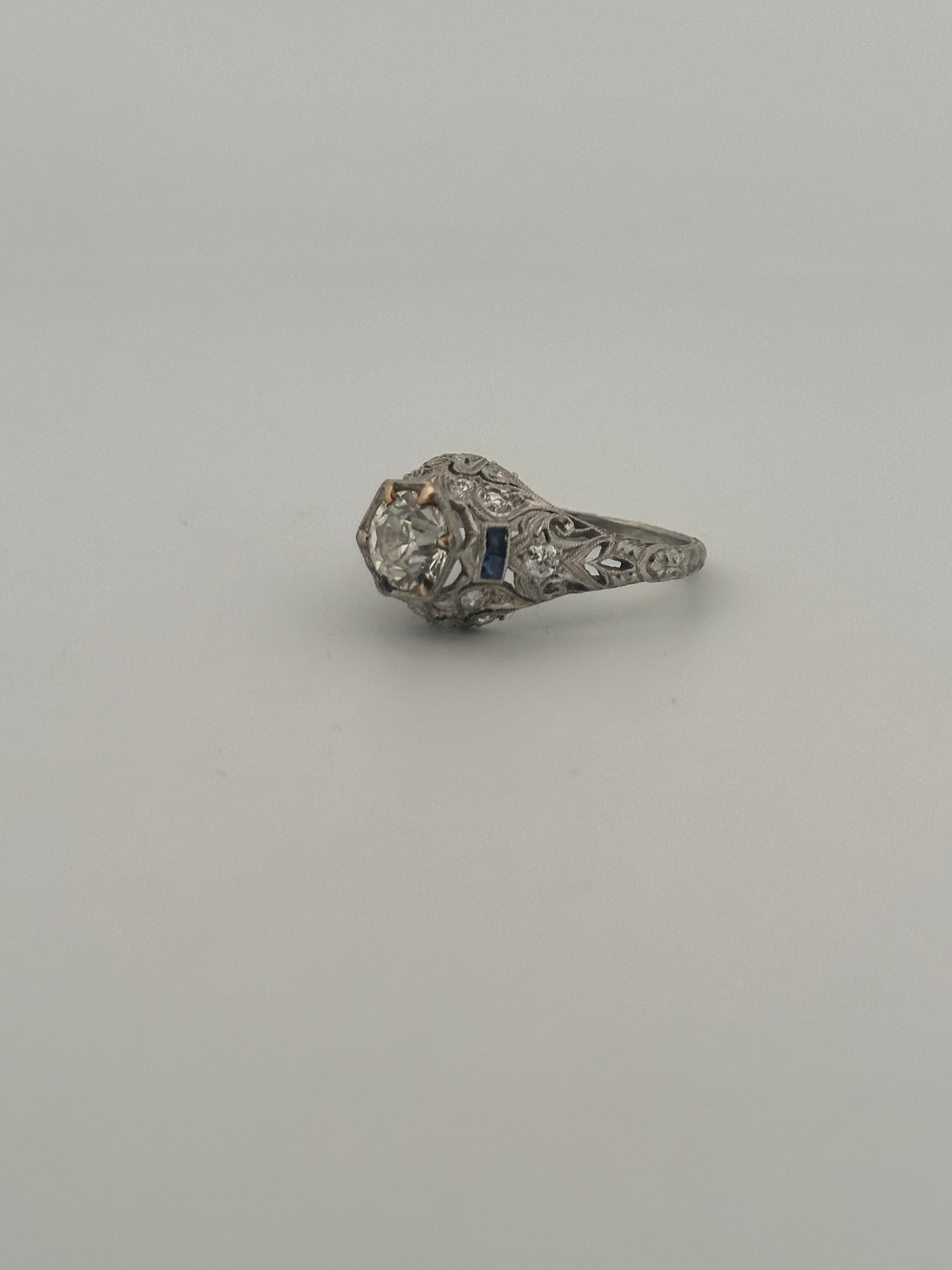 Antique art deco platinum old European cut diamond ring with sapphire accents