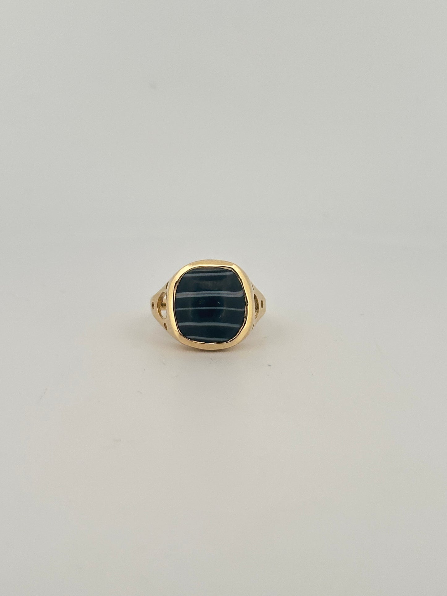 Black banded agate bezel set ring in 10k yellow gold