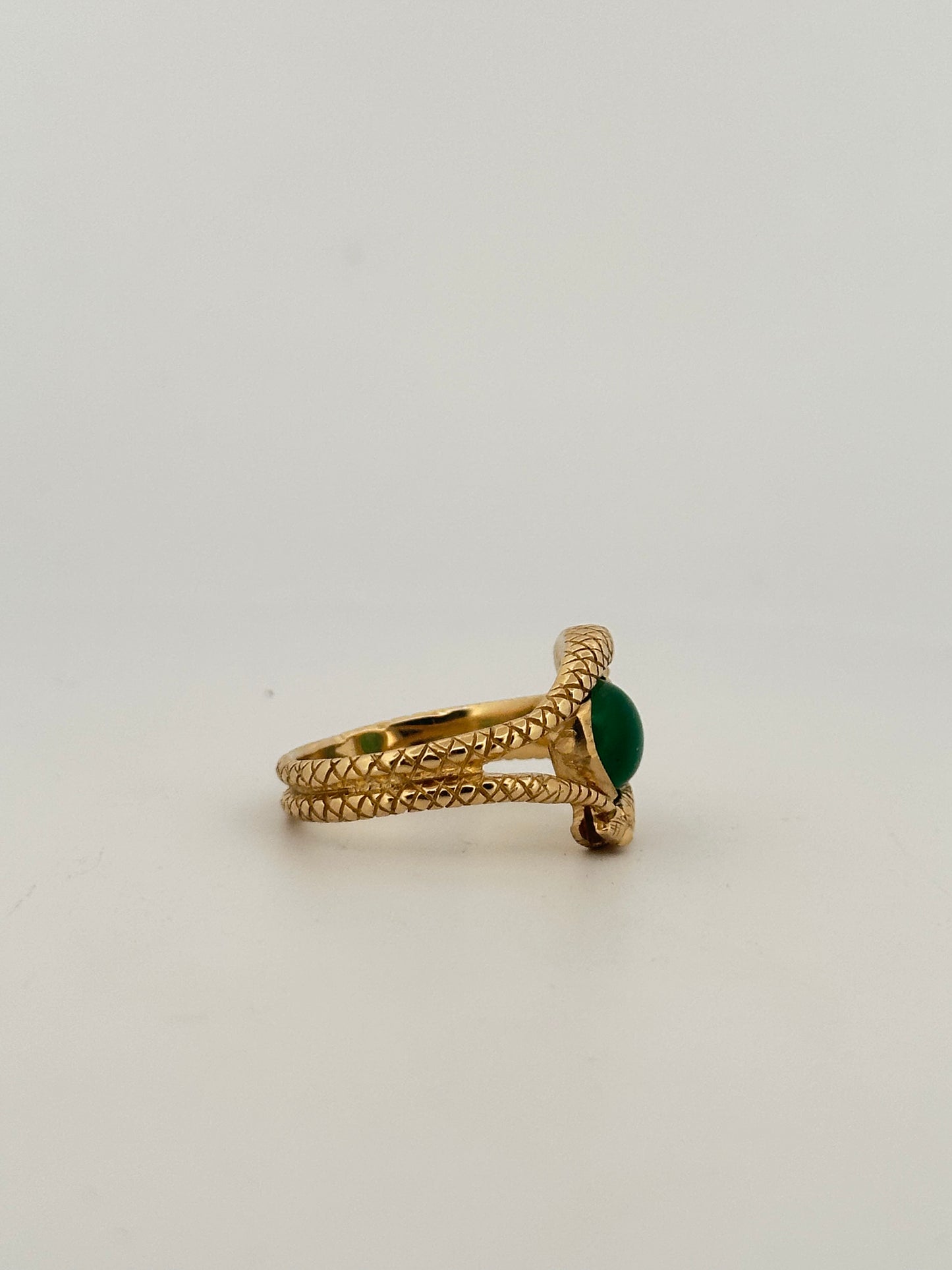 Double snake ring with natural emerald cabochon in 10k yellow gold