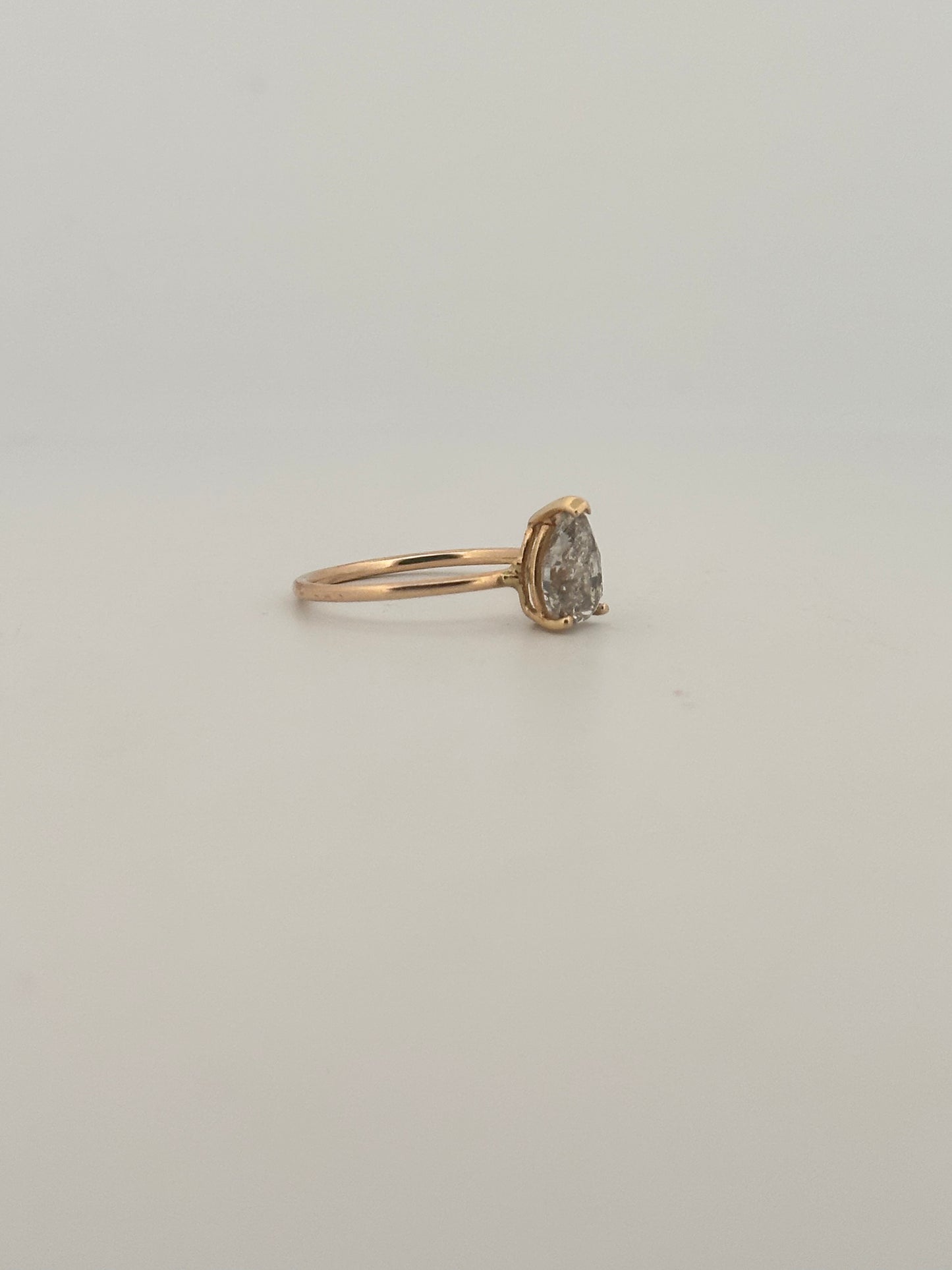 Vintage natural pear shaped diamond solitaire ring in 14k yellow gold