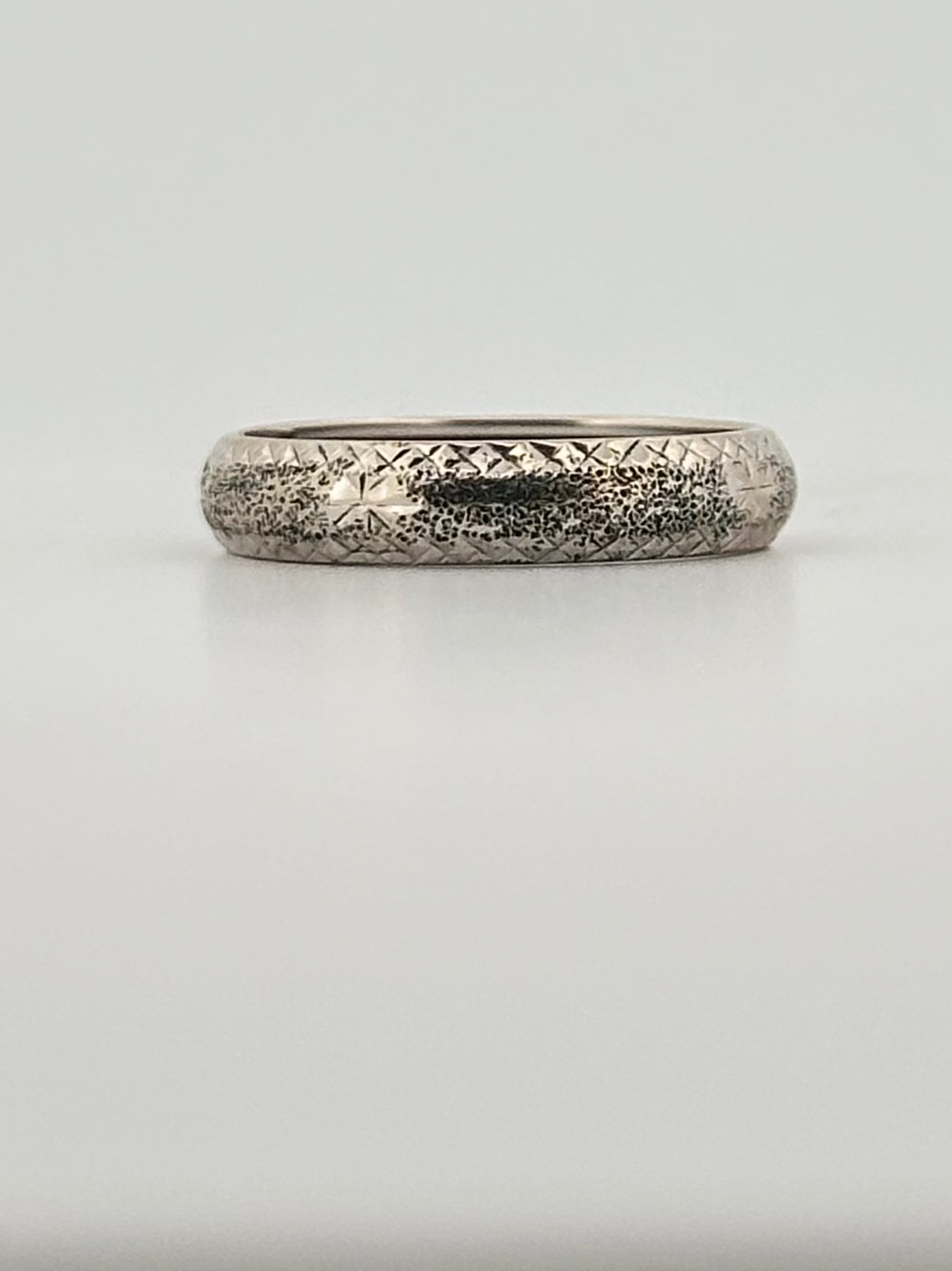 Vintage 14k white gold band with hand engraved detail.
