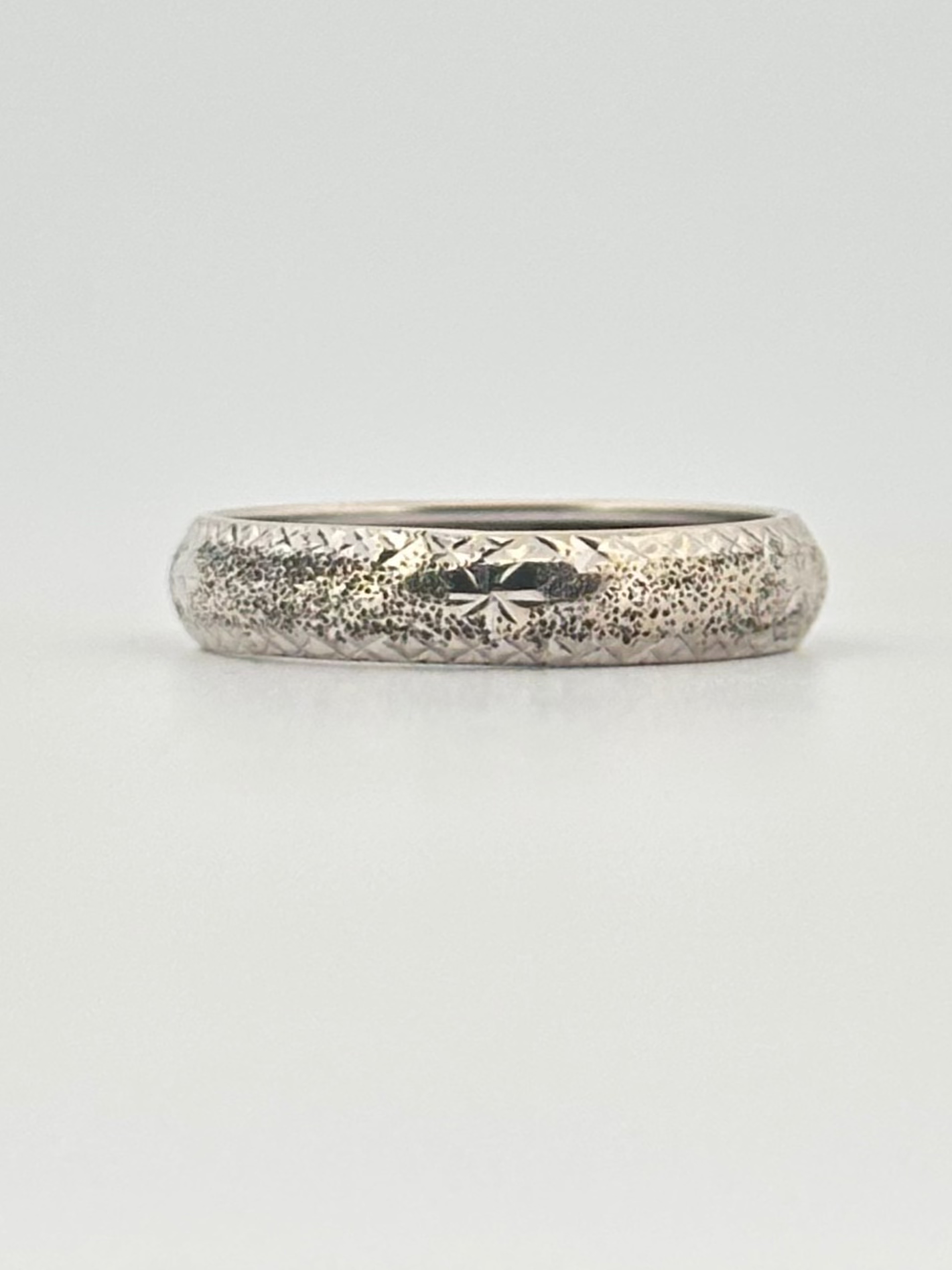 Vintage 14k white gold band with hand engraved detail.