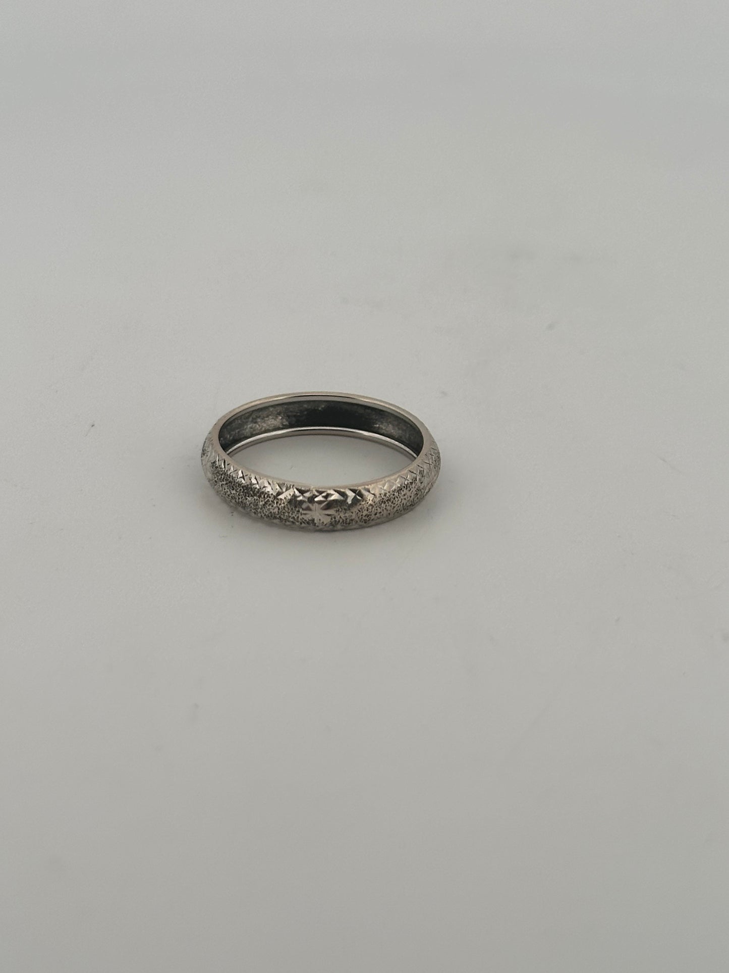 Vintage 14k white gold band with hand engraved detail.