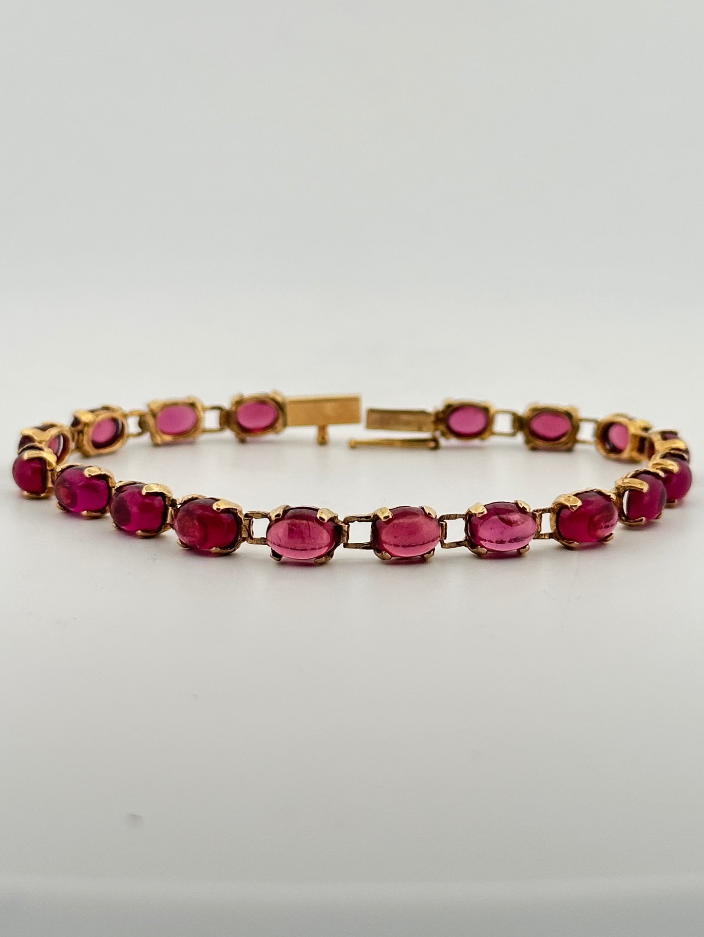 Vintage rhodalite garnet cabochon tennis bracelet in 14k yellow gold